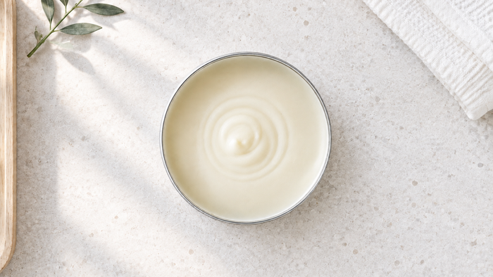 Open tin of CONCHUS aluminium free natural deodorant cream, showing its smooth, creamy texture