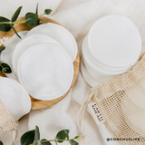 Reusable bamboo and cotton make-up remover rounds in a bamboo holder with a mesh bag